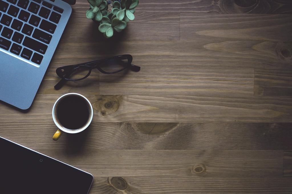 Modern computer workspace with keyboard, mouse and monitor showing digital learning interface