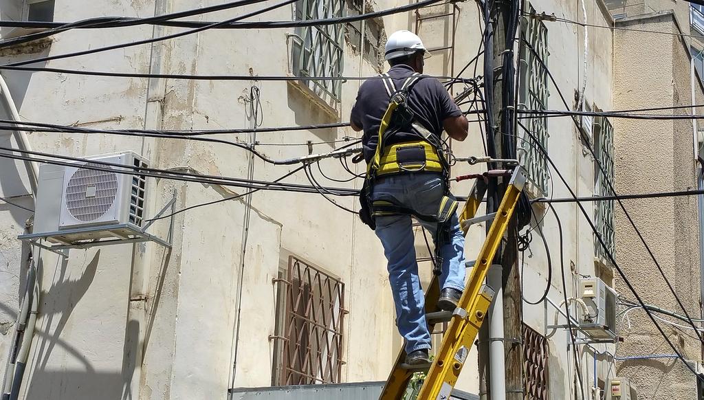 Close up of friendly customer support representative using headset