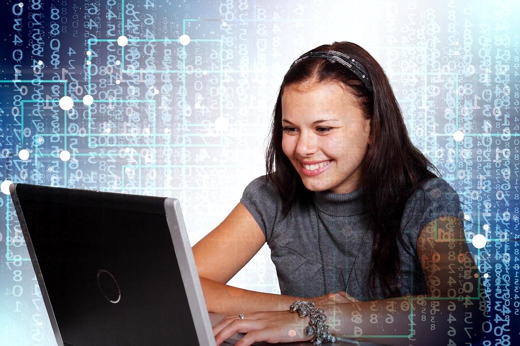 Team collaborating on digital learning project in modern office