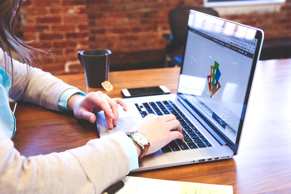 Student wearing VR headset practicing computer skills in immersive virtual environment